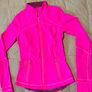 Lululemon size 4, hot pink with black and pink stripes inside collar and hem